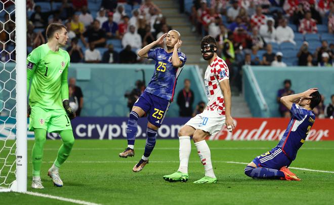 Japan’s Daizen Maeda and Shogo Taniguchi react after a missed chance to score against Croatia at the FIFA World Cup Qatar round of 16 match.