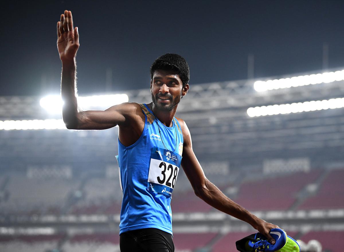 Jinson Johnson of India celebrates victory.