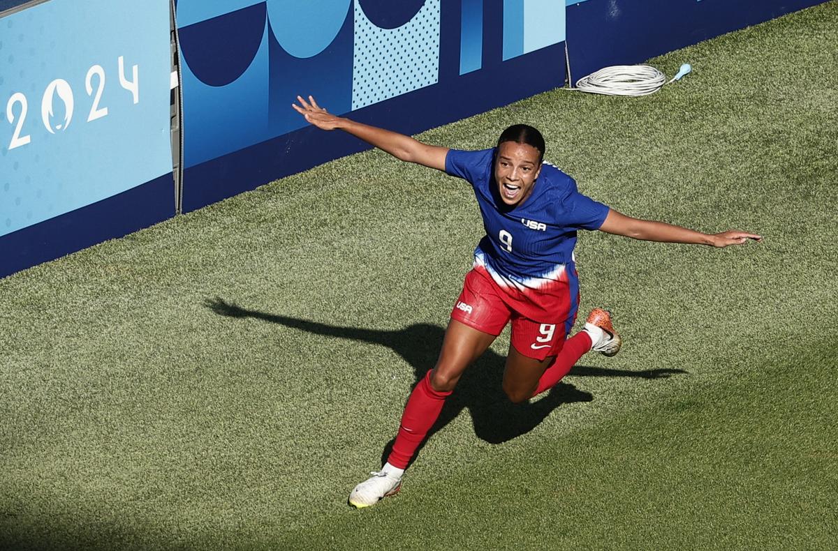 Mallory Swanson of the United States celebrates scoring against Brazil in the gold medal match at the Paris 2024 Olympics.