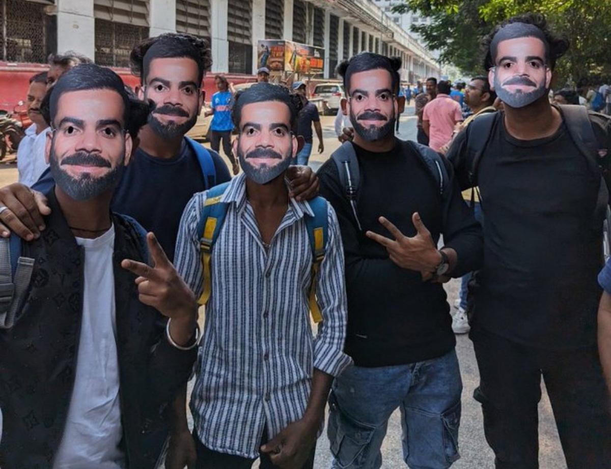 Fans of Virat Kohli pose wearing his masks before the India vs Sri Lanka game in Mumbai. 