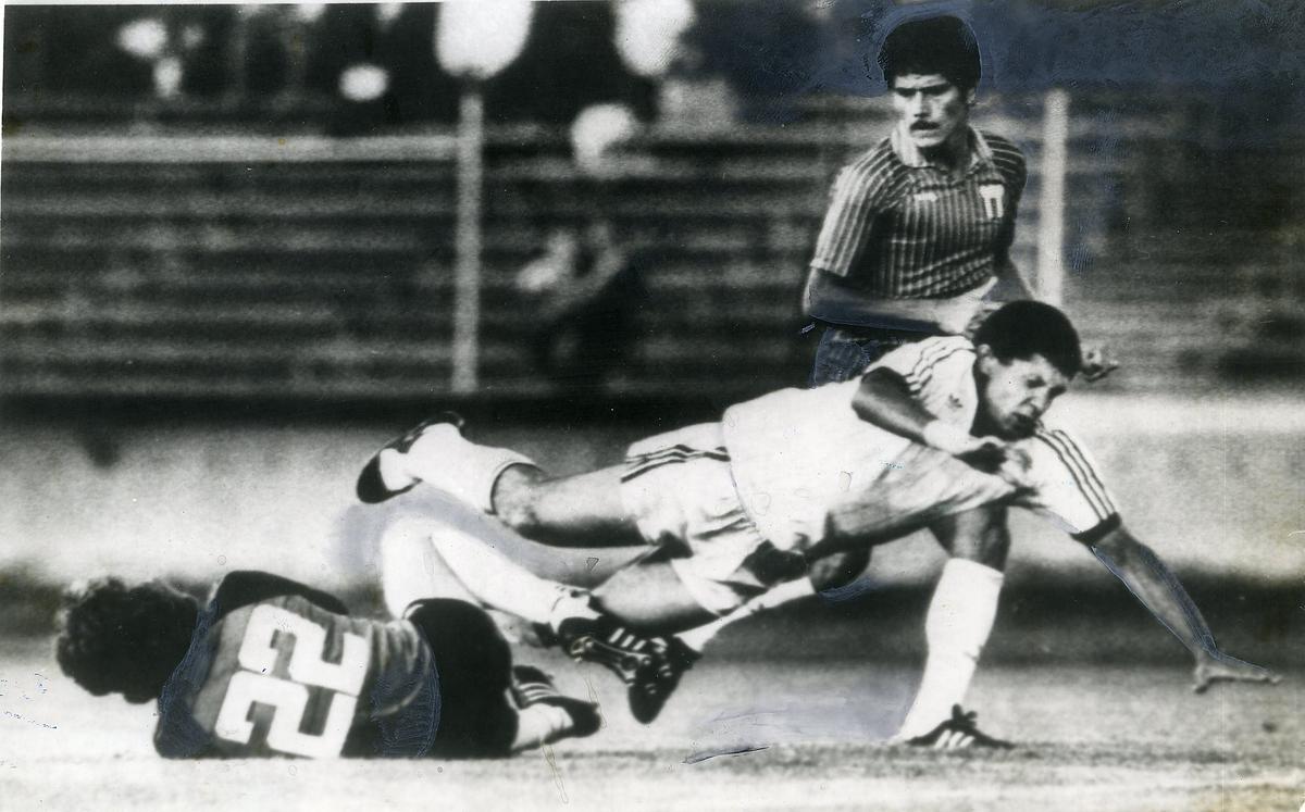 Egypt midfielder Mohamed Hilme is tripped up by Costa Rica goalie Alejandro Gonzales as Costa Rica midfielder Evaristo Corondo watches in the second half of action at Standford University, California on July 31, 1984, during first round of Olympic football.