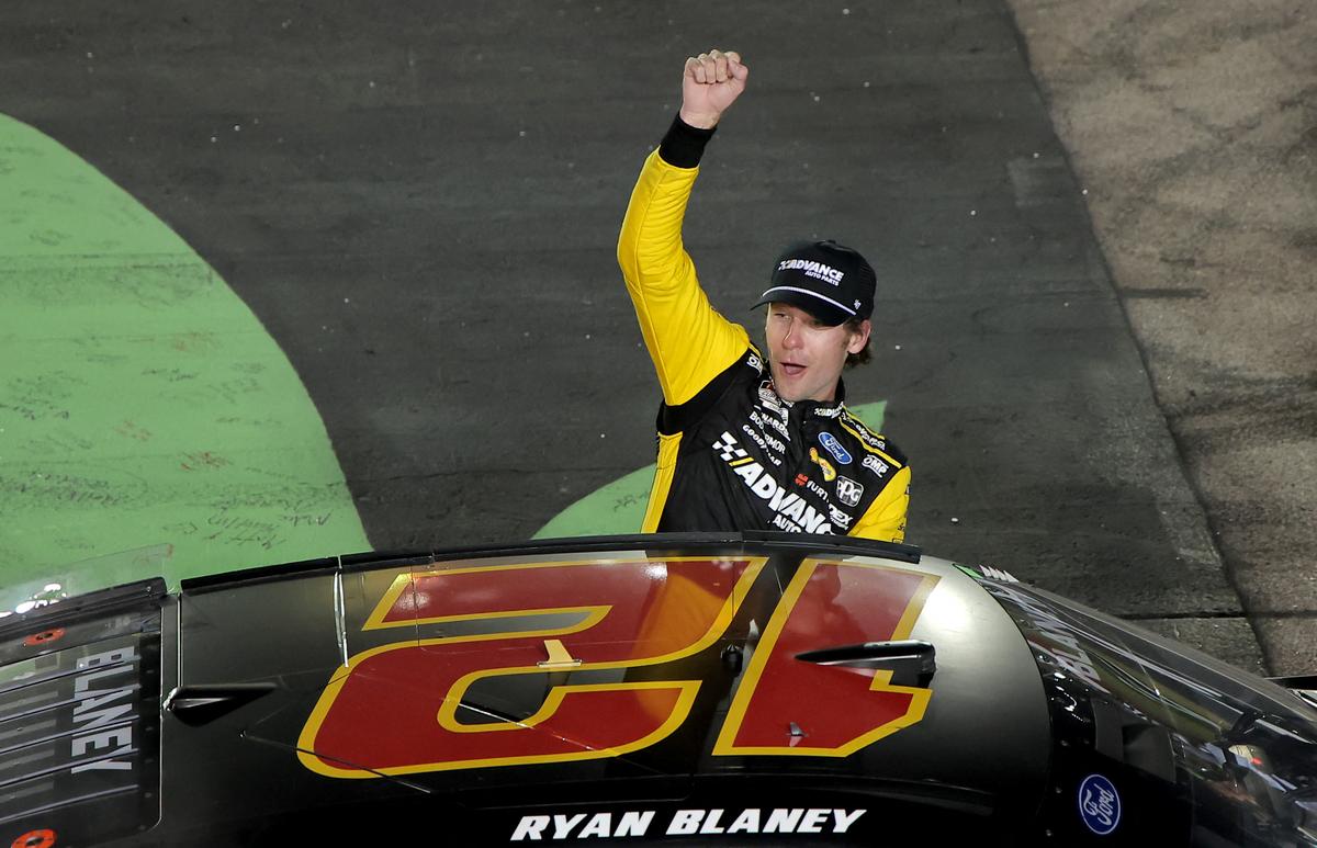 Ryan Blaney, driver of the #12 Advance Auto Parts Ford, celebrates after winning the NASCAR Cup Series Iowa Corn 350.