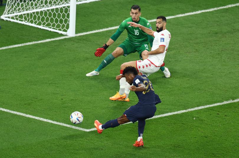 France’s Kingsley Coman shoots at goal agaonst Tunisia at the FIFA World Cup Group D match.