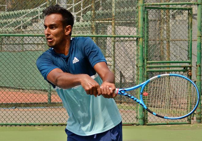 Mukund Sasikumar sweats it out in training at the DLTA
Complex for the $25,000 ITF men’s tennis tournament, on Monday.