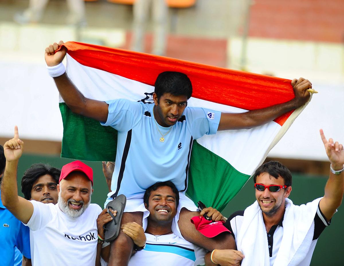 India’s Rohan Bopanna, who beat Brazil’s Ricardo Mello in the Davis Cup World Group play-off match, celebrates with Leander Paes and others at the SDAT Tennis Stadium in Chennai on September 19, 2010. 