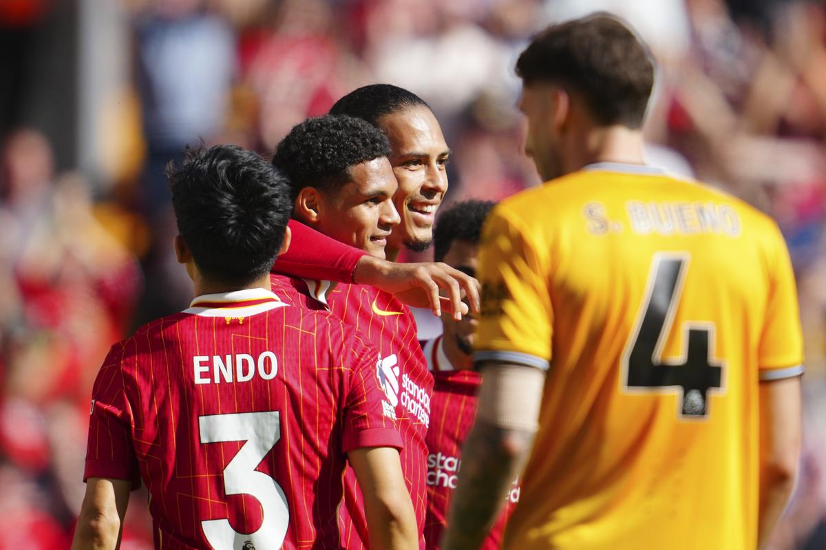 Liverpool’s Jarell Quansah, second left, celebrates with teammates after scoring his side’s second goal during the Premier League match against Wolverhampton Wanderers.