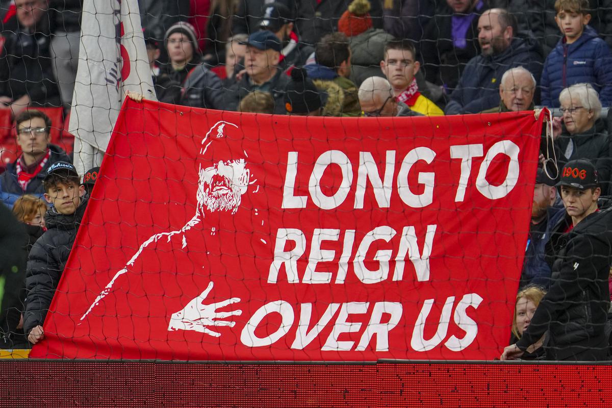 Fans hold a banner depicting Liverpool’s manager Jurgen Klopp prior to the start of the English FA Cup fourth round match between Liverpool and Norwich.