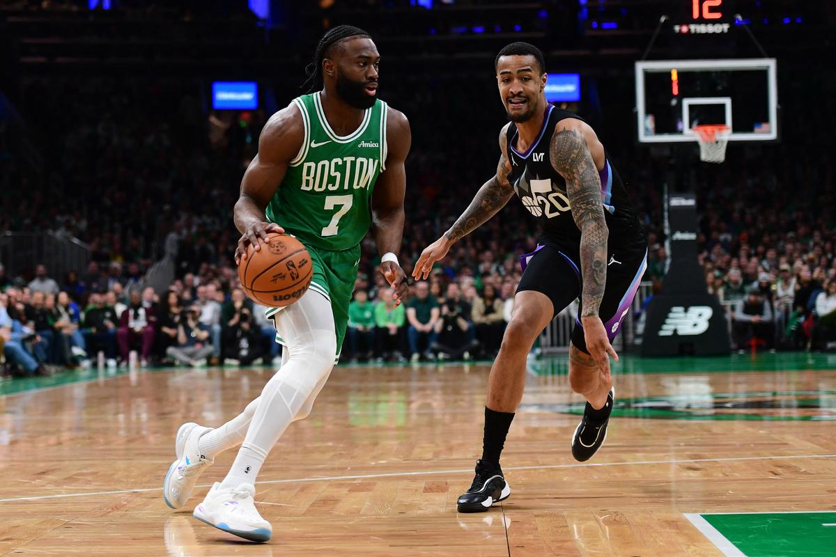 Boston Celtics guard Jaylen Brown (7) controls the ball while Utah Jazz forward John Collins (20) defends during the first half at TD Garden.