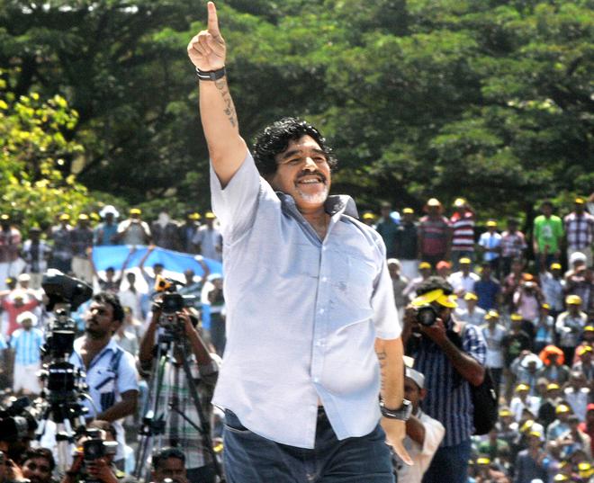 Football legend Diego Armando Maradona dances to Spanish tunes during a public reception at Jawahar Stadium in Kannur.