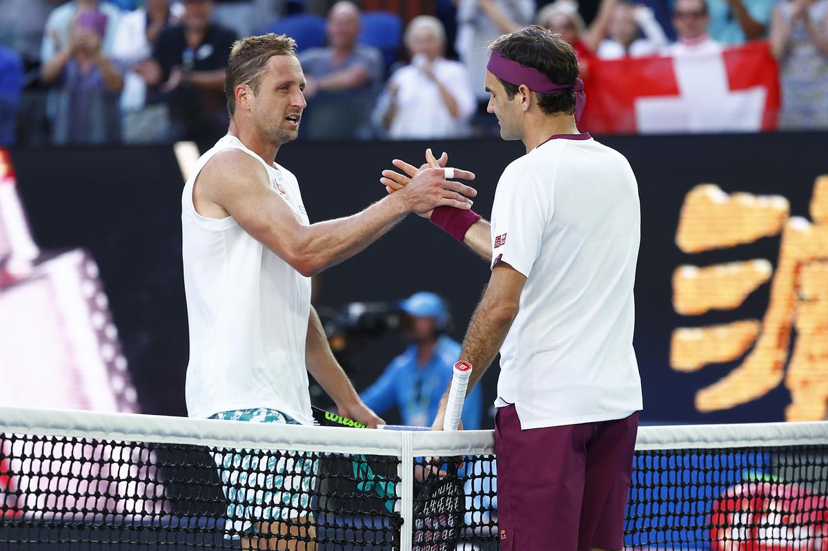 Fun with a pun: After beating Tennys Sandgren (left) at the 2020 Australian Open, Roger Federer (right) quipped, “I played a lot of tennis in my life. But never Tennys.”