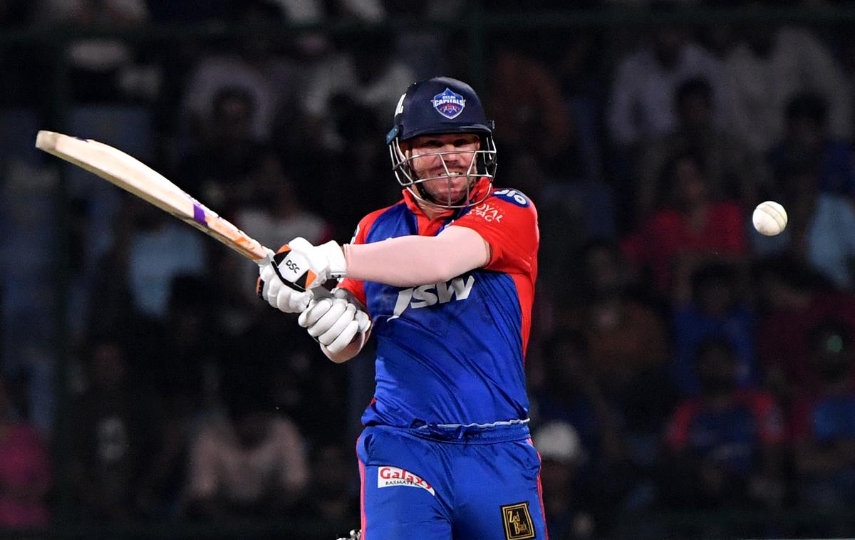 FILE PHOTO: Delhi Capitals Captain David Warner plays a shot against Punjab Kings during the IPL T20 Match at the Arun Jaitley Cricket Stadium in New Delhi.