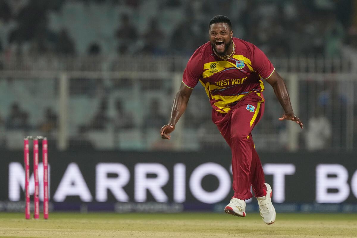 West Indies’ Romario Shepherd celebrates after taking the wicket of Scotland’s Safyaan Sharif.