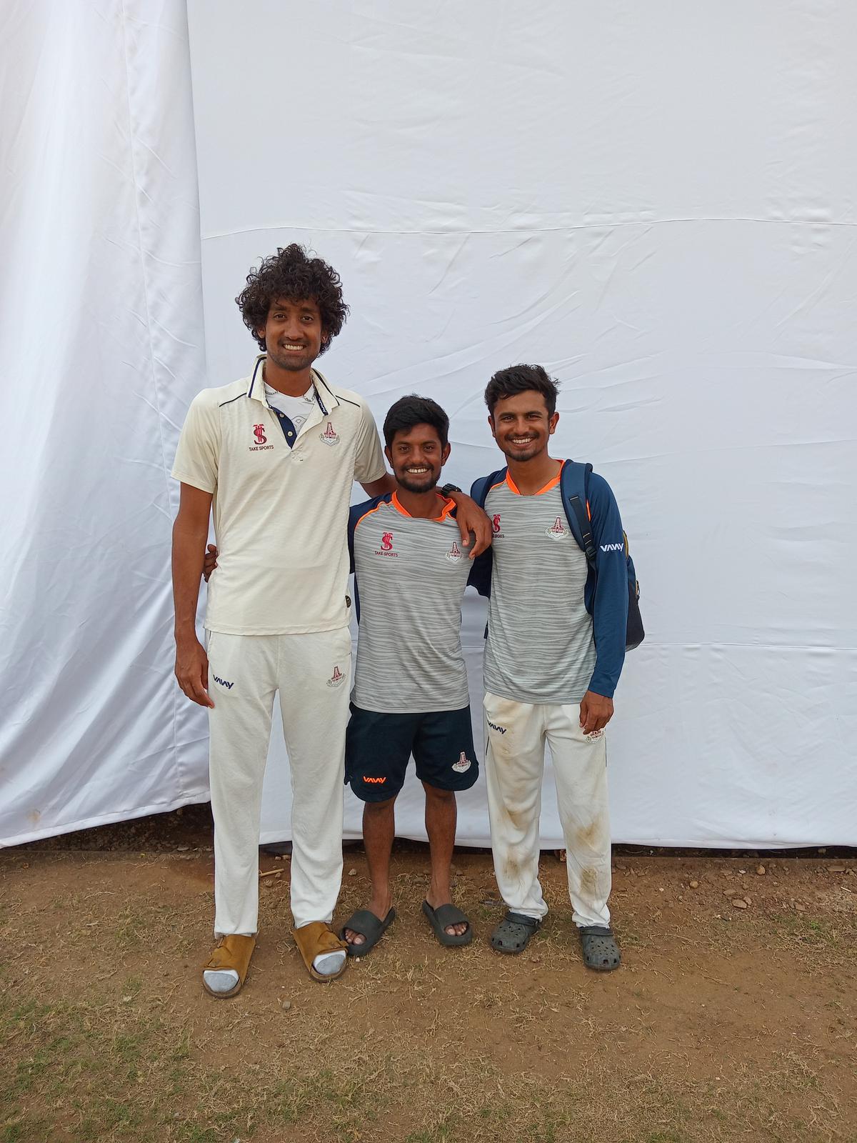 S. Lokeshwar (c) with his skipper Sai Kishore (l) and teammate Pradosh Ranjan Paul (r) after Tamil Nadu’s seven-wicket win over Goa at the Goa Cricket Association (GCA) Academy ground on Monday.