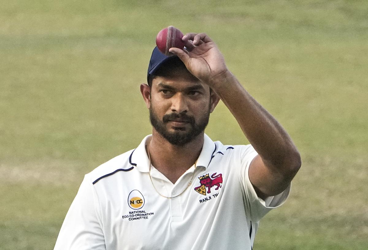 Mumbai’s Royston Dias gestures with the ball after the team won the Ranji Trophy quarterfinal cricket match against Haryana, at Eden Gardens in Kolkata,.