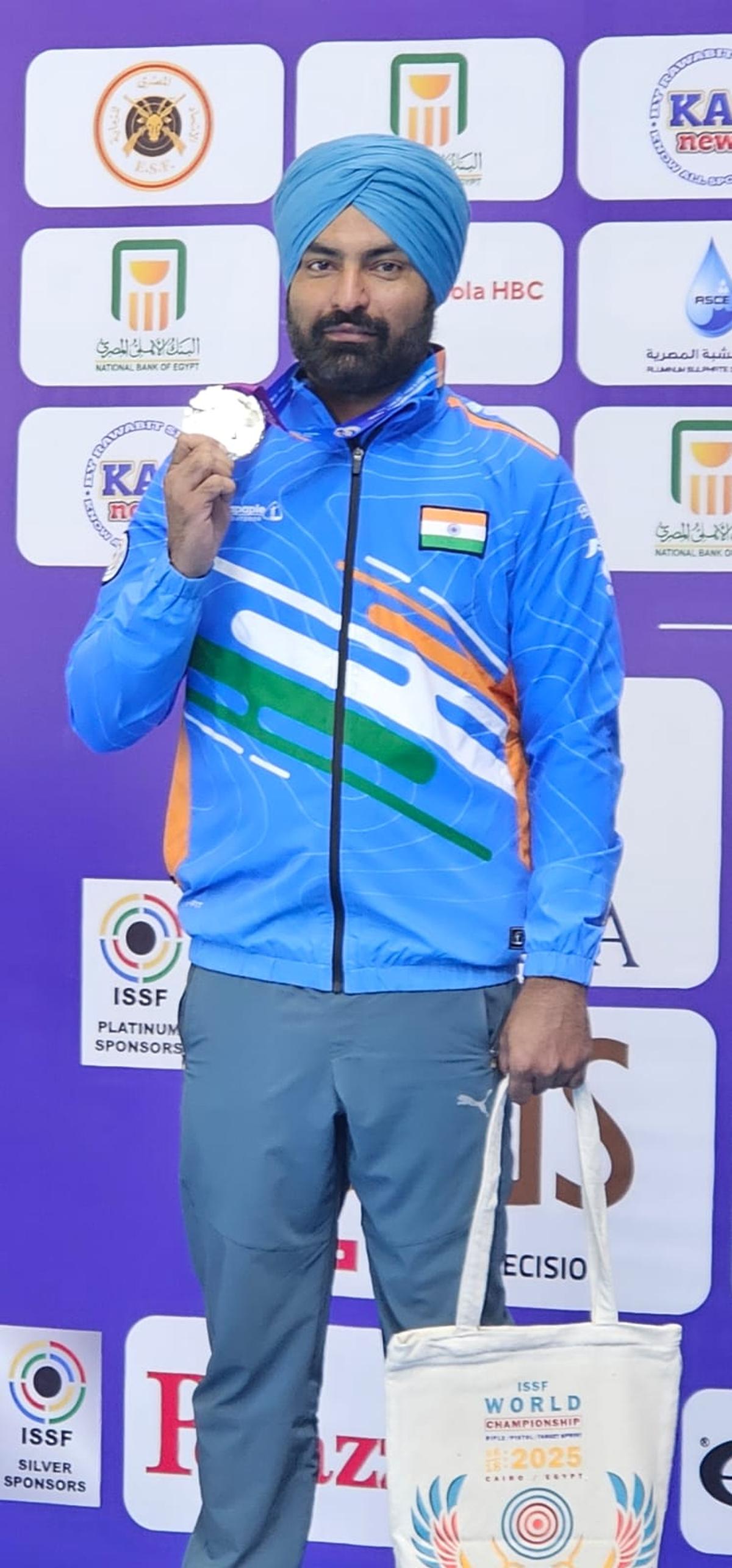 Gurpreet Singh with his silver medal in the 25m Centre Fire Pistol event.