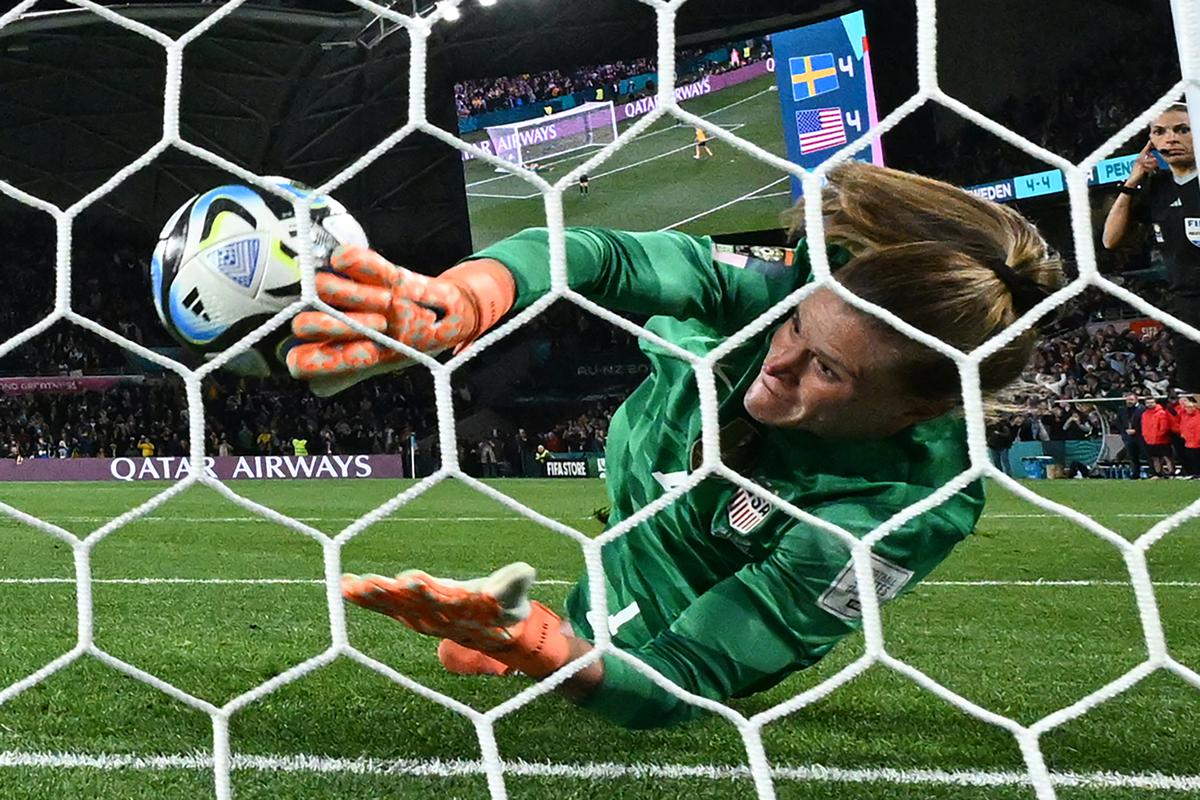 USA’s goalkeeper #01 Alyssa Naeher concedes the winning goal scored by Sweden’s forward #08 Lina Hurtig (unseen) in the penalty shout-out during the round of 16 football match between Sweden and USA at Melbourne Rectangular Stadium in Melbourne on August 6, 2023. 