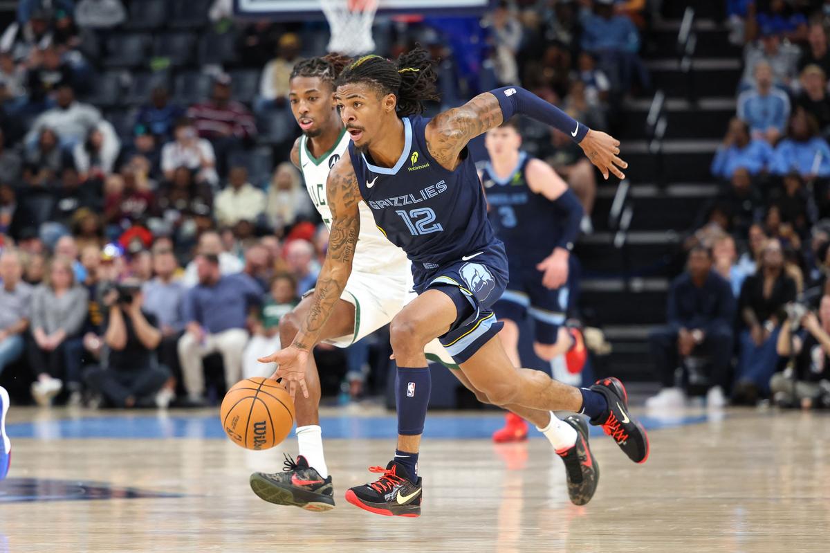 Ja Morant #12 of the Memphis Grizzlies drives the ball against the Milwaukee Bucks.