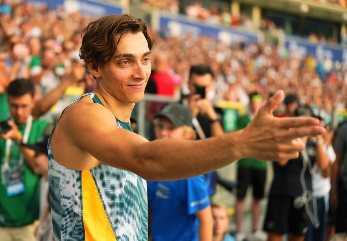 Owning the moment: Duplantis celebrated for the cameras with a finger-pistol salute, inspired by Turkish shooter and Paris Olympics silver medallist Yusuf Dikec. 