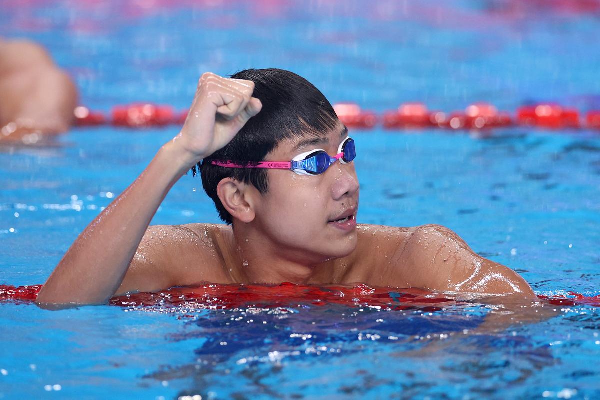  Zhanshuo Zhang of China celebrates after winning gold in the men’s 4x200m freestyle final on day fifteen of the Doha 2024 World Aquatics Championships.