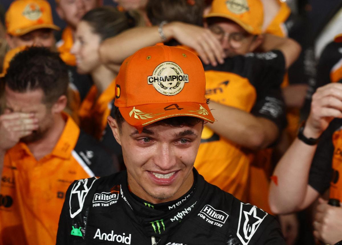 McLaren’s Lando Norris celebrates with his team after becoming the 2025 Formula One World Champion.
