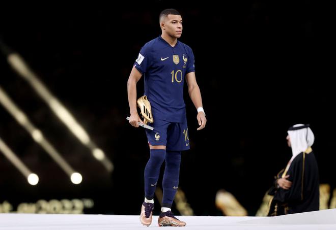 Kylian Mbappe of France reacts after receiving his Golden Boot award during the awards ceremony after the FIFA World Cup Qatar 2022 Final match between Argentina and France at Lusail Stadium.