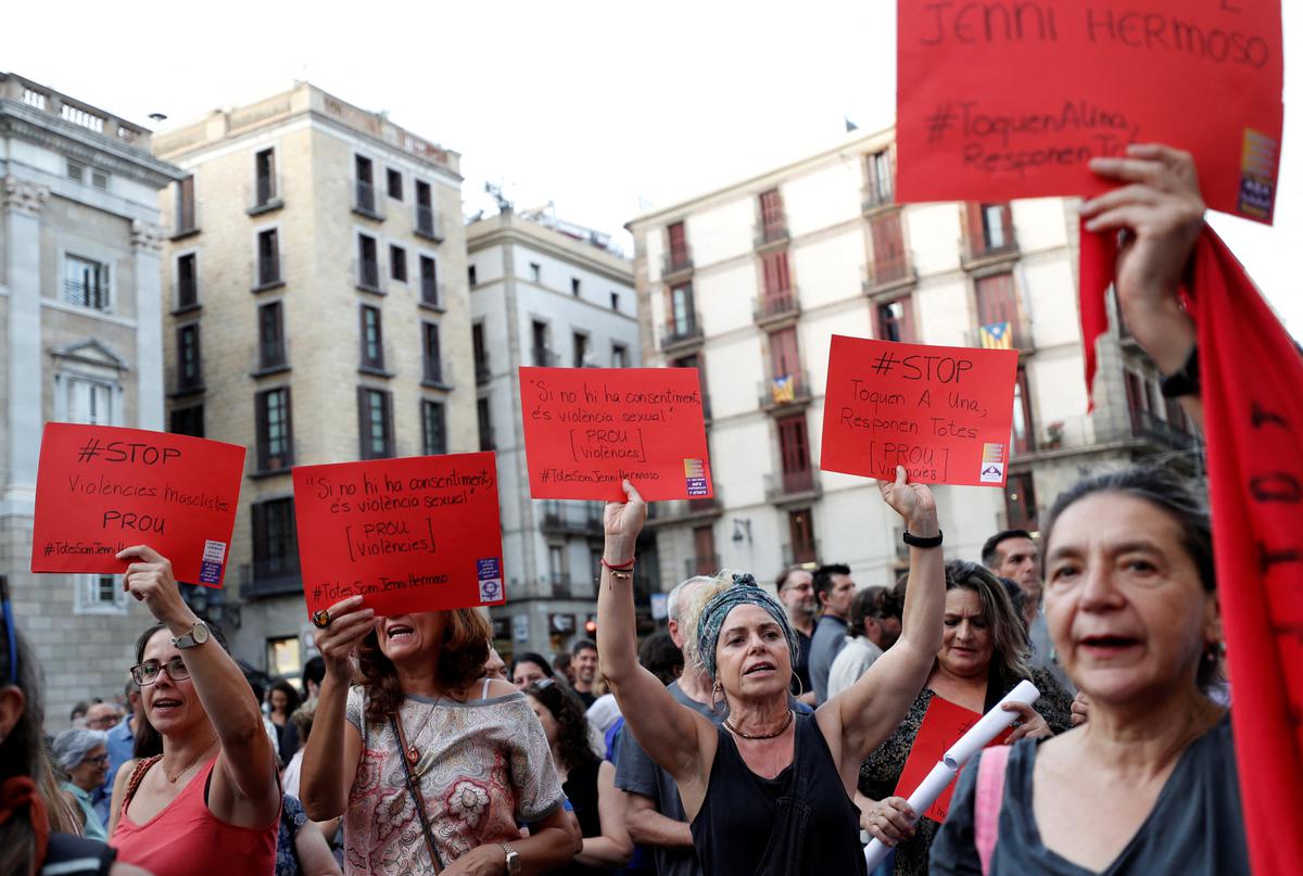 Women hold placards, depicting red card in football, that read “Stop Violence against Women” during a protest against Royal Spanish Football Federation President Luis Rubiales and in support of the player Jenni Hermoso in Barcelona.
