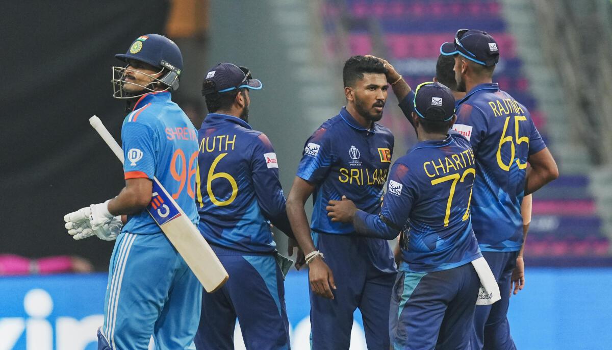 Sri Lankan bowler Dilshan Madushanka celebrates the wicket of Indian batter Shreyas Iyer. 