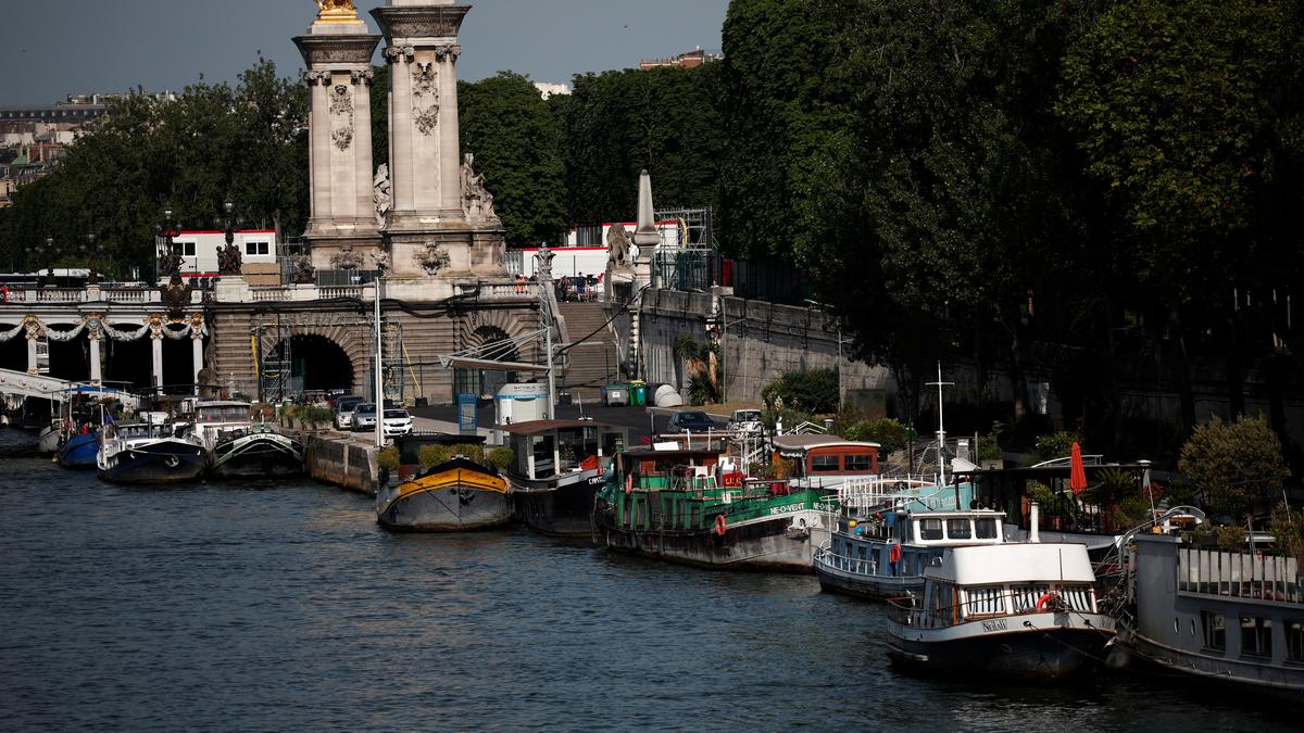 Paris Olympics organizers say swimming events still set for the cleaned-up Seine after heavy rains