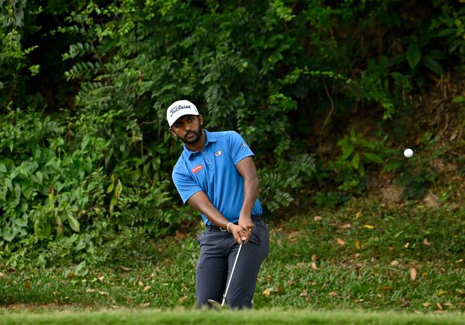 Chikkarangappa S. of India playing a shot during round one of the World City Championship presented by the Hong Kong Golf Club.