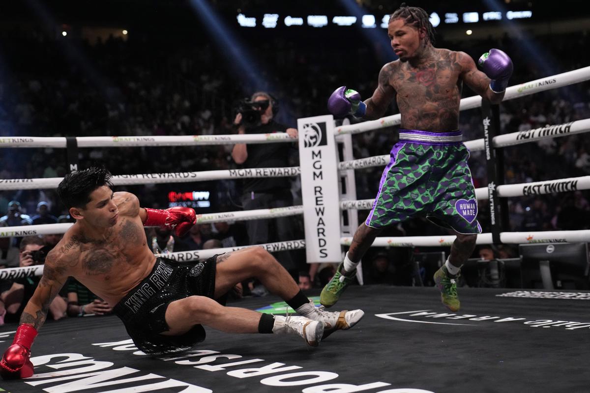 Gervonta Davis knocks down Ryan Garcia during the seventh-round finish. 