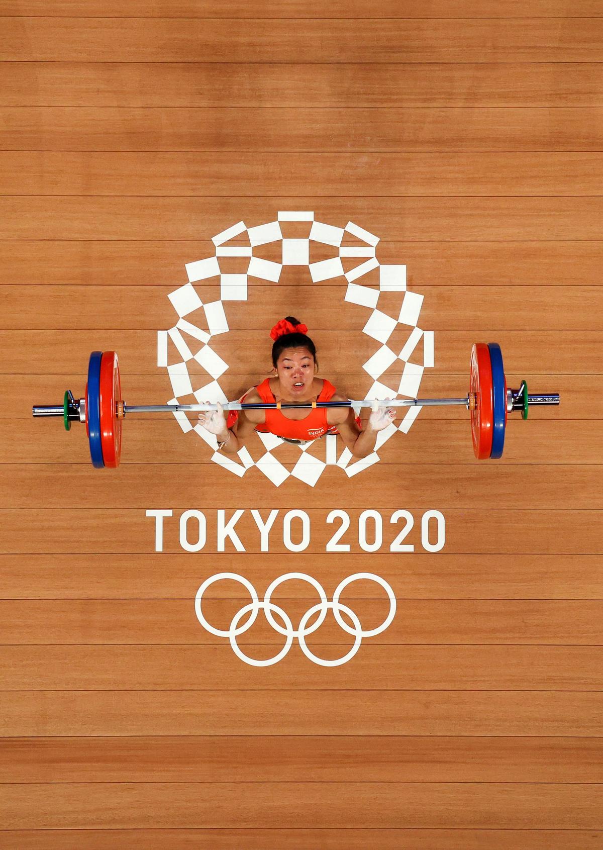 Mirabai Chanu’s unfinished business before the big switch She might be India’s greatest-ever weightlifter, but Mirabai Chanu doesn’t demand any special favours at the end of a morning training session at the Weightlifting Warriors gym in Modinagar, just outside New Delhi. Having hoisted hundreds of kilos of iron weights, several tonnes in total, during an hour-and-a-half session, overhead, the Olympic medallist now pulls the same weights off her barbell and back onto the racks.But where most of the other elite international weightlifters at this gym, operated by national coach Vijay Sharma, stop at this point, Mirabai isn’t done after the last plate is put away. She takes a cloth and wipes off the barbell, removing the white chalk deposited from her palms over the course of dozens of lifts in the training session.She doesn’t think much of it.“I’ve always done this,” she tells Sportstar later. “I consider the barbell nothing less than the weapon a soldier carries into battle. Just like he keeps his weapon clean, I also have to maintain my equipment. I also have to be an example to younger weightlifters,” she says.Since beginning her international career in 2014, Mirabai has faced her share of challenges and built a record that will be hard to emulate.Having already won titles at the World Championships, medals at the Asian Championships, Commonwealth Games and, of course, an Olympic silver, Mirabai has shown few signs of slowing down. Last year, she won another world medal, a silver in the women’s 48kg category. Then, at the National Championships in February this year, she lifted a Personal Best of 89kg in the snatch. She followed that with a 116kg lift in the clean and jerk to total 205kg, equalling her Personal Best recorded at the 2021 Asian Championships in the 49kg category. Mirabai Chanu created history by winning India’s first-ever weightlifting silver medal in the Olympics, after lifting a total of 202 kg in the women’s 49 kg event at the Tokyo 2020 Olympic Games
| Photo Credit:
Getty Images
Mirabai Chanu created history by winning India’s first-ever weightlifting silver medal in the Olympics, after lifting a total of 202 kg in the women’s 49 kg event at the Tokyo 2020 Olympic Games
| Photo Credit:
Getty Images
Tough phaseWhile she is in strong form, Mirabai knows this phase will be among her toughest. Last year, the International Weightlifting Federation announced that weight categories for the 2028 Los Angeles Olympics were being rejigged. The lightest women’s category, 49kg, in which Mirabai has competed for most of the last decade and won silver at the Tokyo Olympics, was dropped from the Olympic programme.She will have no choice but to move up to the 53kg division. She plans to first compete in this higher category at the 2026 Asian Games in Tokyo. But she has unfinished business first. Mirabai will compete in the 48kg category at both the upcoming Asian Championships and Commonwealth Games. She has already won two gold medals in this category at the latter (2018, 2022) and wants to sign off with another.“The Commonwealth Games will be my last competition in the 48kg category. I want to leave this category by doing something special. I think I am in good shape for this. Last year, after the Olympic weight categories were changed, I had to move down to the 48kg class. In the new IWF categories, the 48kg class is the lightest, although it is not an Olympic category. But even after I started competing in this class, my performance is the same as in the 49kg category, and in some ways even better,” she says.“In my last competition, I want to do better than I’ve ever done at the Commonwealth Games. When I analyse my training, I think my performance is going really well. I already hold the Commonwealth record and will try to achieve even more.”She has a number in mind: a 90kg snatch and a 120kg clean and jerk.Increased confidence“I got a lot of confidence from the National Championships. I lifted 89kg in the snatch on my second attempt. Then I attempted 91kg in my third. I’ve never attempted anything above 90kg in training. So even though I didn’t complete the lift, it gives me confidence to simply attempt that weight in competition. It’s the same with the clean and jerk. I’ve never touched 120kg in training before attempting it in competition. Now I know what that weight feels like.“I keep a diary of my lifts where I write that I can cross 90kg in the snatch and 120kg in the clean and jerk. I know I am getting close,” she says.At the 2025 World Championships DPR Korea’s Kang Hyon-gyong had won gold with a combined lift of 214kg.Mirabai’s confidence, she says, comes not just from attempting the biggest weights of her career but also from staying injury-free for much of the past couple of years. Mirabai began her 2026 season at the National Weightlifting Championships in February and set three new national records in the women’s 48kg category.
| Photo Credit:
SHASHI SHEKHAR KASHYAP
Mirabai began her 2026 season at the National Weightlifting Championships in February and set three new national records in the women’s 48kg category.
| Photo Credit:
SHASHI SHEKHAR KASHYAP
“In my career, I’ve suffered a lot of injuries to my joints, wrists and shoulders. But I’ve been working on my technique, especially in the first and second pull of the snatch and how I receive the bar overhead. All this has helped me avoid injuries,” she says.Mirabai has another goal this year: a medal at the Asian Games. For all her accomplishments, she has never medalled at the continental event. Her closest finish was fourth at Hangzhou.“I’ve never won a medal at the Asian Games. I’ve done everything else. This is the one medal I don’t have. More than anything, that’s my target this year,” she says.While the Asian Games may be seen as a stepping stone to the 2028 Olympics, Mirabai isn’t looking that far ahead.“As of now, I’m focused on the Asian Games. Only after that will I think about the Olympic weight category. Of course, I want to go to the Olympics, but I will see how my body responds at the Asian Games. If it adapts well to the new category, I will have more confidence,” she says.Difficult shiftThe move to the 53kg division will be challenging. At 4’11, Mirabai will not find it easy to add the additional 5kg of muscle mass, more than 10 per cent of her body weight, that she will need.The level of competition will also be higher. At last year’s World Championships, the bronze-medal total was 200kg, compared to 198kg in the women’s 48kg category. The number could have been higher had China’s Du Meiyuan not withdrawn due to injury.Additionally, many of her competitors have already been preparing for the 53kg category, while Mirabai will only transition after the Commonwealth Games.Yet, she isn’t overly concerned. Lifting 205kg at her current body weight gives her confidence that she can lift more with additional muscle. At 31, Mirabai knows she is in the latter stages of her career, but she is determined to push as long as she can. “As long as I have that motivation, I’ll keep fighting,” she says.
| Photo Credit:
SHASHI SHEKHAR KASHYAP
At 31, Mirabai knows she is in the latter stages of her career, but she is determined to push as long as she can. “As long as I have that motivation, I’ll keep fighting,” she says.
| Photo Credit:
SHASHI SHEKHAR KASHYAP
She is, in fact, looking forward to one aspect of the transition.“I’ve been 48–49kg for many years. One of the hardest things was constantly controlling what I ate. It took a lot of motivation to remind myself why I was doing it.“After the Tokyo Olympics, Domino’s gave me a free pizza-for-life deal, but I never really used it because I couldn’t eat it! So one thing I’m looking forward to is eating a bit more,” she says.For now, she remains focused. At 31, she knows she is in the latter stages of her career, but she is determined to push as long as she can.“People say that in sport you start deteriorating with age. That may be true. But I believe motivation matters just as much. Every competition motivates me. It shows me the way forward and reminds me of the work I’ve put in over the years.“As long as I have that motivation, I’ll keep fighting,” she says.Published on Apr 13, 2026More stories from this issue #Mirabai #Chanus #unfinished #business #big #switch Mirabai Chanu’s unfinished business before the big switch She might be India’s greatest-ever weightlifter, but Mirabai Chanu doesn’t demand any special favours at the end of a morning training session at the Weightlifting Warriors gym in Modinagar, just outside New Delhi. Having hoisted hundreds of kilos of iron weights, several tonnes in total, during an hour-and-a-half session, overhead, the Olympic medallist now pulls the same weights off her barbell and back onto the racks.But where most of the other elite international weightlifters at this gym, operated by national coach Vijay Sharma, stop at this point, Mirabai isn’t done after the last plate is put away. She takes a cloth and wipes off the barbell, removing the white chalk deposited from her palms over the course of dozens of lifts in the training session.She doesn’t think much of it.“I’ve always done this,” she tells Sportstar later. “I consider the barbell nothing less than the weapon a soldier carries into battle. Just like he keeps his weapon clean, I also have to maintain my equipment. I also have to be an example to younger weightlifters,” she says.Since beginning her international career in 2014, Mirabai has faced her share of challenges and built a record that will be hard to emulate.Having already won titles at the World Championships, medals at the Asian Championships, Commonwealth Games and, of course, an Olympic silver, Mirabai has shown few signs of slowing down. Last year, she won another world medal, a silver in the women’s 48kg category. Then, at the National Championships in February this year, she lifted a Personal Best of 89kg in the snatch. She followed that with a 116kg lift in the clean and jerk to total 205kg, equalling her Personal Best recorded at the 2021 Asian Championships in the 49kg category. Mirabai Chanu created history by winning India’s first-ever weightlifting silver medal in the Olympics, after lifting a total of 202 kg in the women’s 49 kg event at the Tokyo 2020 Olympic Games
| Photo Credit:
Getty Images
Mirabai Chanu created history by winning India’s first-ever weightlifting silver medal in the Olympics, after lifting a total of 202 kg in the women’s 49 kg event at the Tokyo 2020 Olympic Games
| Photo Credit:
Getty Images
Tough phaseWhile she is in strong form, Mirabai knows this phase will be among her toughest. Last year, the International Weightlifting Federation announced that weight categories for the 2028 Los Angeles Olympics were being rejigged. The lightest women’s category, 49kg, in which Mirabai has competed for most of the last decade and won silver at the Tokyo Olympics, was dropped from the Olympic programme.She will have no choice but to move up to the 53kg division. She plans to first compete in this higher category at the 2026 Asian Games in Tokyo. But she has unfinished business first. Mirabai will compete in the 48kg category at both the upcoming Asian Championships and Commonwealth Games. She has already won two gold medals in this category at the latter (2018, 2022) and wants to sign off with another.“The Commonwealth Games will be my last competition in the 48kg category. I want to leave this category by doing something special. I think I am in good shape for this. Last year, after the Olympic weight categories were changed, I had to move down to the 48kg class. In the new IWF categories, the 48kg class is the lightest, although it is not an Olympic category. But even after I started competing in this class, my performance is the same as in the 49kg category, and in some ways even better,” she says.“In my last competition, I want to do better than I’ve ever done at the Commonwealth Games. When I analyse my training, I think my performance is going really well. I already hold the Commonwealth record and will try to achieve even more.”She has a number in mind: a 90kg snatch and a 120kg clean and jerk.Increased confidence“I got a lot of confidence from the National Championships. I lifted 89kg in the snatch on my second attempt. Then I attempted 91kg in my third. I’ve never attempted anything above 90kg in training. So even though I didn’t complete the lift, it gives me confidence to simply attempt that weight in competition. It’s the same with the clean and jerk. I’ve never touched 120kg in training before attempting it in competition. Now I know what that weight feels like.“I keep a diary of my lifts where I write that I can cross 90kg in the snatch and 120kg in the clean and jerk. I know I am getting close,” she says.At the 2025 World Championships DPR Korea’s Kang Hyon-gyong had won gold with a combined lift of 214kg.Mirabai’s confidence, she says, comes not just from attempting the biggest weights of her career but also from staying injury-free for much of the past couple of years. Mirabai began her 2026 season at the National Weightlifting Championships in February and set three new national records in the women’s 48kg category.
| Photo Credit:
SHASHI SHEKHAR KASHYAP
Mirabai began her 2026 season at the National Weightlifting Championships in February and set three new national records in the women’s 48kg category.
| Photo Credit:
SHASHI SHEKHAR KASHYAP
“In my career, I’ve suffered a lot of injuries to my joints, wrists and shoulders. But I’ve been working on my technique, especially in the first and second pull of the snatch and how I receive the bar overhead. All this has helped me avoid injuries,” she says.Mirabai has another goal this year: a medal at the Asian Games. For all her accomplishments, she has never medalled at the continental event. Her closest finish was fourth at Hangzhou.“I’ve never won a medal at the Asian Games. I’ve done everything else. This is the one medal I don’t have. More than anything, that’s my target this year,” she says.While the Asian Games may be seen as a stepping stone to the 2028 Olympics, Mirabai isn’t looking that far ahead.“As of now, I’m focused on the Asian Games. Only after that will I think about the Olympic weight category. Of course, I want to go to the Olympics, but I will see how my body responds at the Asian Games. If it adapts well to the new category, I will have more confidence,” she says.Difficult shiftThe move to the 53kg division will be challenging. At 4’11, Mirabai will not find it easy to add the additional 5kg of muscle mass, more than 10 per cent of her body weight, that she will need.The level of competition will also be higher. At last year’s World Championships, the bronze-medal total was 200kg, compared to 198kg in the women’s 48kg category. The number could have been higher had China’s Du Meiyuan not withdrawn due to injury.Additionally, many of her competitors have already been preparing for the 53kg category, while Mirabai will only transition after the Commonwealth Games.Yet, she isn’t overly concerned. Lifting 205kg at her current body weight gives her confidence that she can lift more with additional muscle. At 31, Mirabai knows she is in the latter stages of her career, but she is determined to push as long as she can. “As long as I have that motivation, I’ll keep fighting,” she says.
| Photo Credit:
SHASHI SHEKHAR KASHYAP
At 31, Mirabai knows she is in the latter stages of her career, but she is determined to push as long as she can. “As long as I have that motivation, I’ll keep fighting,” she says.
| Photo Credit:
SHASHI SHEKHAR KASHYAP
She is, in fact, looking forward to one aspect of the transition.“I’ve been 48–49kg for many years. One of the hardest things was constantly controlling what I ate. It took a lot of motivation to remind myself why I was doing it.“After the Tokyo Olympics, Domino’s gave me a free pizza-for-life deal, but I never really used it because I couldn’t eat it! So one thing I’m looking forward to is eating a bit more,” she says.For now, she remains focused. At 31, she knows she is in the latter stages of her career, but she is determined to push as long as she can.“People say that in sport you start deteriorating with age. That may be true. But I believe motivation matters just as much. Every competition motivates me. It shows me the way forward and reminds me of the work I’ve put in over the years.“As long as I have that motivation, I’ll keep fighting,” she says.Published on Apr 13, 2026More stories from this issue #Mirabai #Chanus #unfinished #business #big #switch