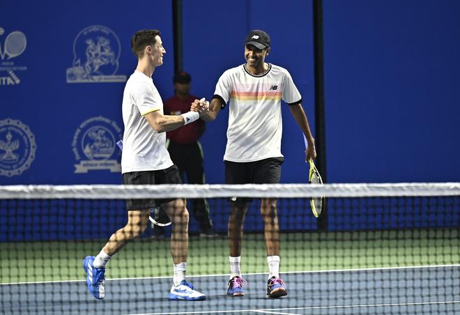 Joe Salisbury (left) and Rajeev Ram (right) celebrate after their opening-round win at the Tata Open Maharashtra in Pune on Tuesday.