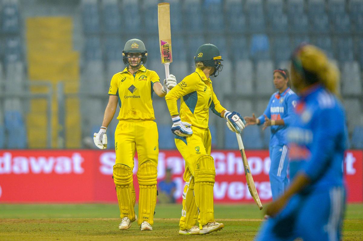 Ellyse Perry of Australia celebrates after scoring fifty with Phoebe Litchfield of Australia during the 1st ODI match against India.