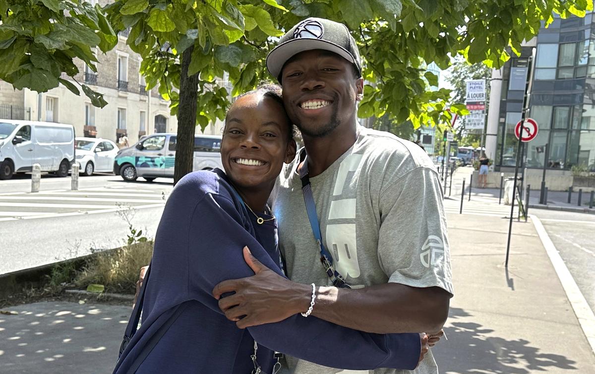 Jasmine Moore and her boyfriend Joseph Fahnbulleh pose near the athletes village at the 2024 Summer Olympics. 