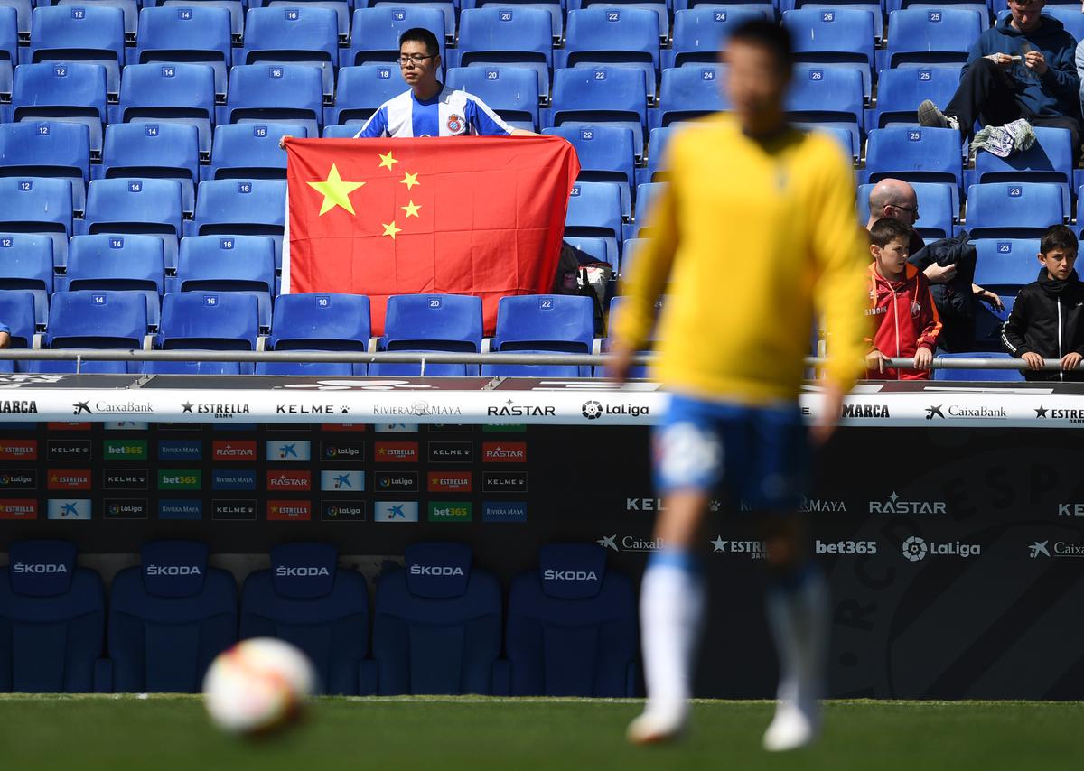 China detains football team president