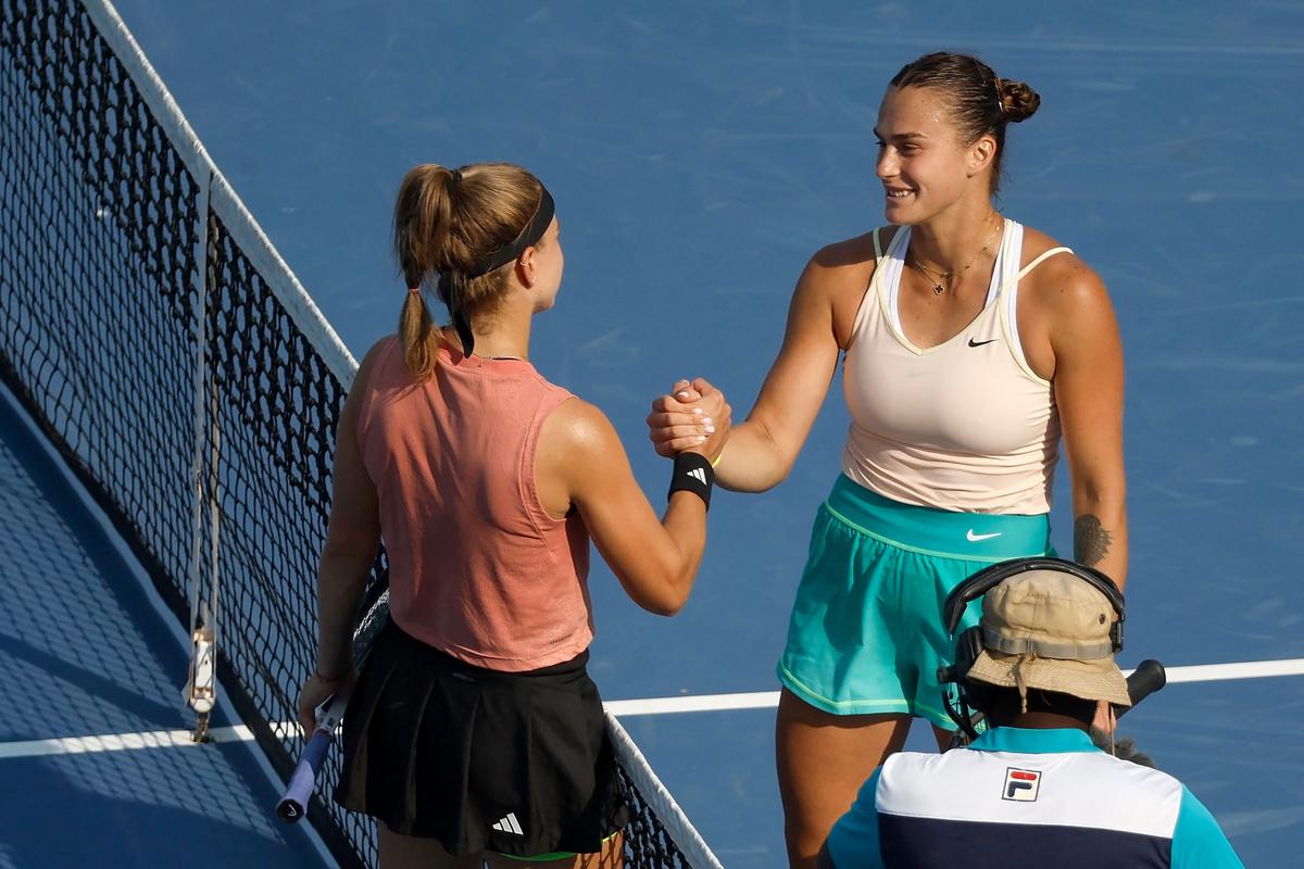 Karolina Muchova of the Czech Republic shakes hands with Aryna Sabalenka of Belarus after winning the semifinal of the Cincinnati Open. 