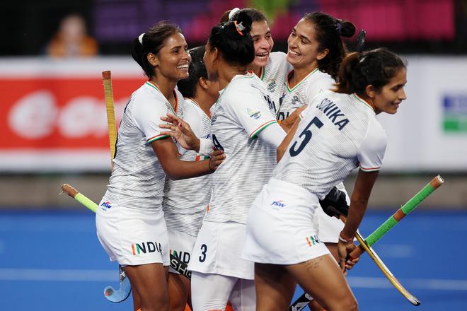 Vandana Katariya of India celebrates with teammates after scoring her team’s third goal against Wales. 
