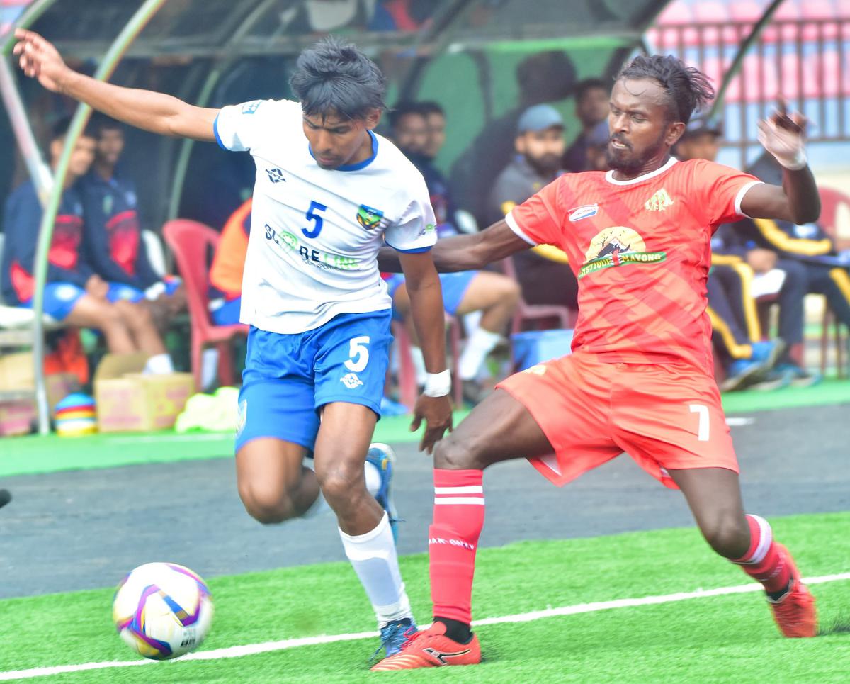 A midfield tussle between Kerala’s Abdu Raheem (left, No. 5) and Assam’s Rahul Das in the Santosh Trophy National Football Championship at Yupia, Arunachal Pradesh, on Wednesday.