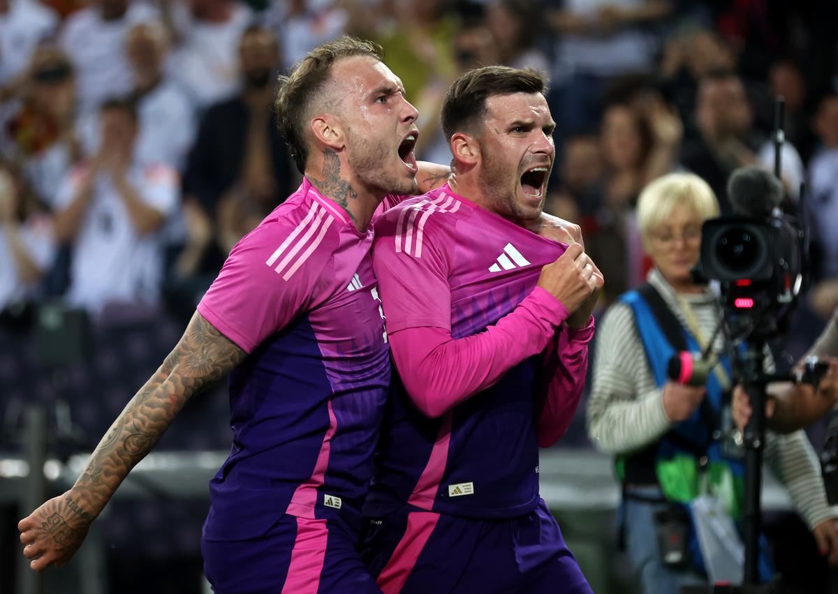 Germany’s Pascal Gross (right) celebrates scoring his team’s second goal with teammate David Raum (left) during the international friendly match against Greece at Borussia Park Stadium on Friday in Moenchengladbach.