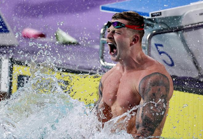 Adam Peaty of England celebrates after winning gold in the Men’s 50m Breaststroke event. 
