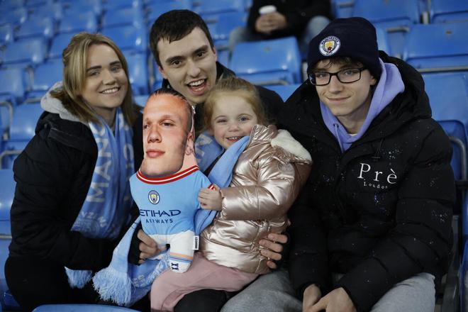  Manchester City fans inside the stadium hold up a toy depicting Manchester City’s Erling Braut Haaland.