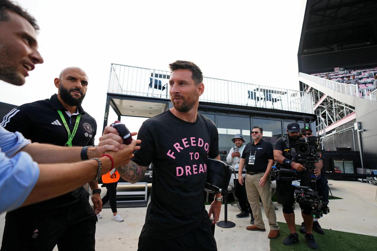 Inter Miami CF forward Lionel Messi (10) is greeted as he arrives at DRV PNK Stadium before the game against Atlanta United