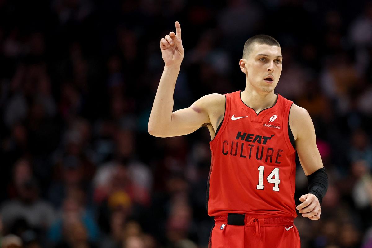 Tyler Herro #14 of the Miami Heat reacts following a basket during the second half of the game against the Charlotte Hornets at Spectrum Center in Charlotte, North Carolina.