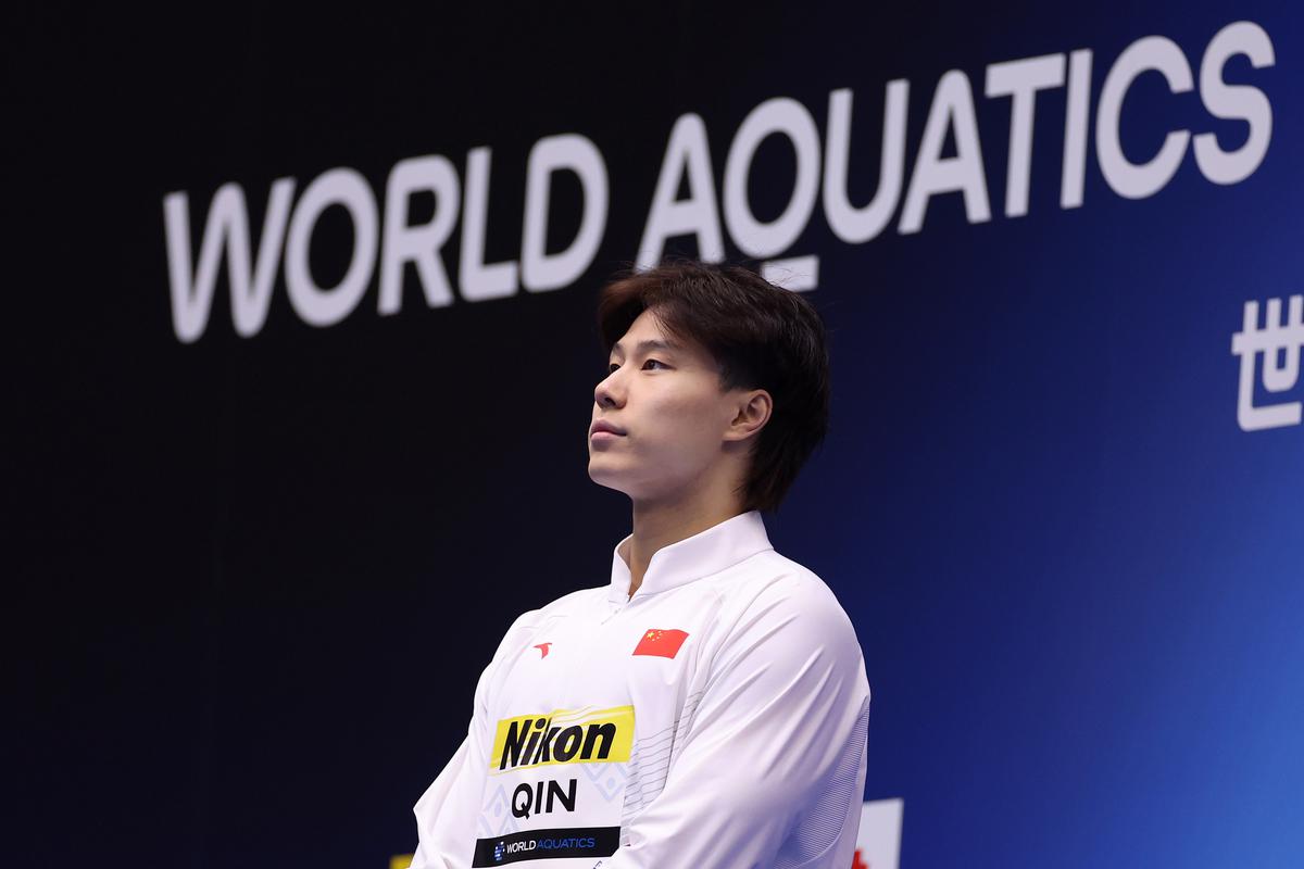 Gold medallist Haiyang Qin of Team China looks on during the medal ceremony for Men’s 50m Breaststroke Final on day four of the Fukuoka 2023 World Aquatics Championships