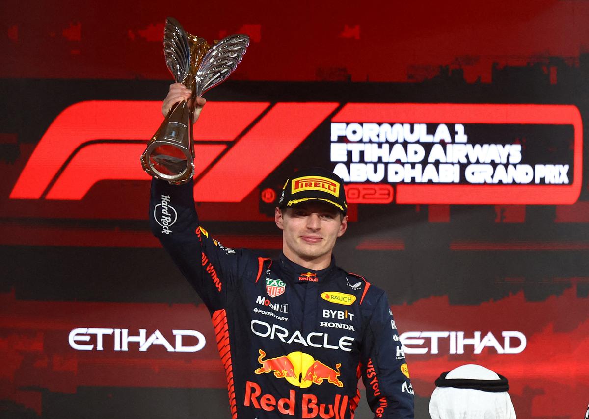 FILE PHOTO: Red Bull’s Max Verstappen celebrates with the trophy on the podium after winning the Abu Dhabi Grand Prix race at the Yas Marina Circuit.