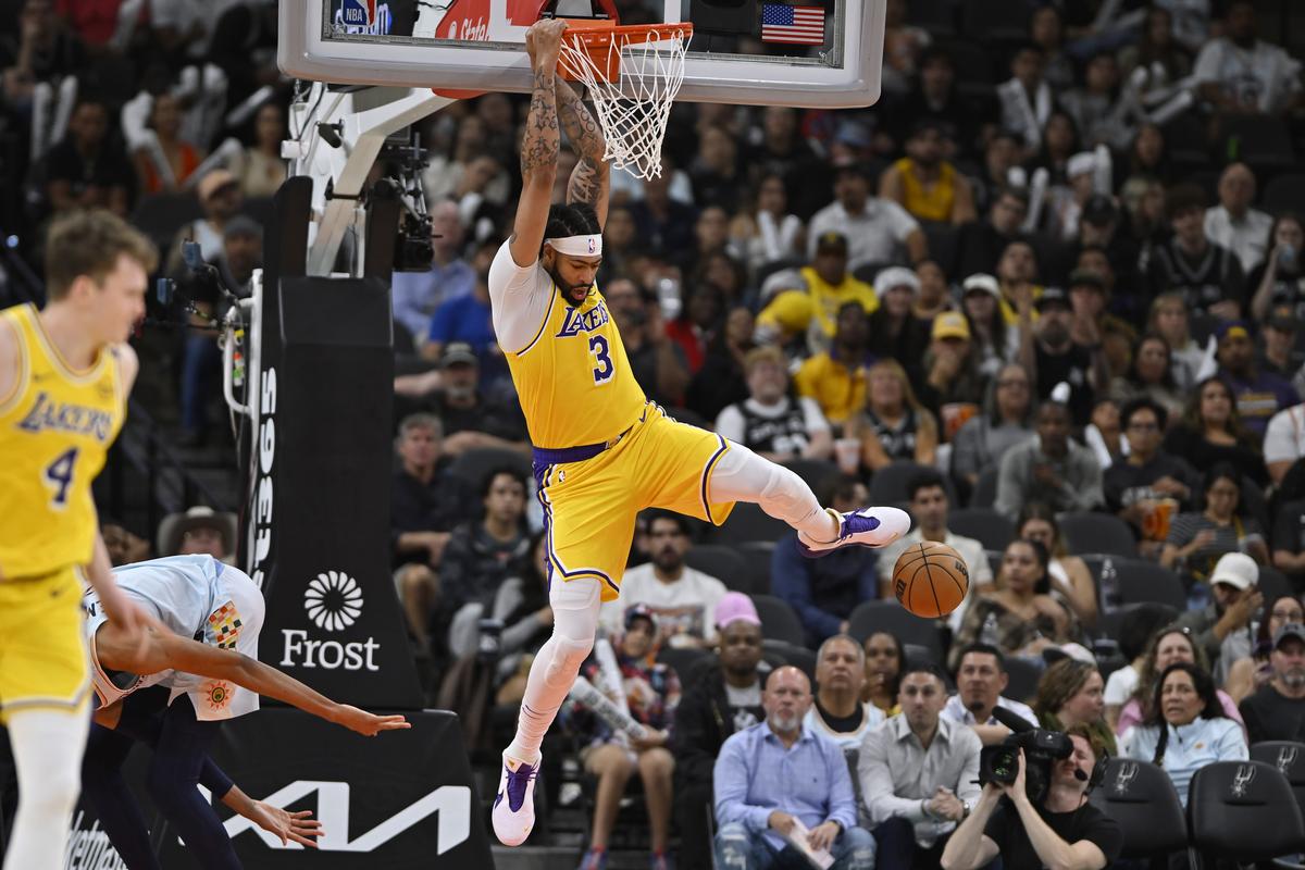 Los Angeles Lakers’ Anthony Davis dunks during the second half of an NBA basketball game against the San Antonio Spurs.