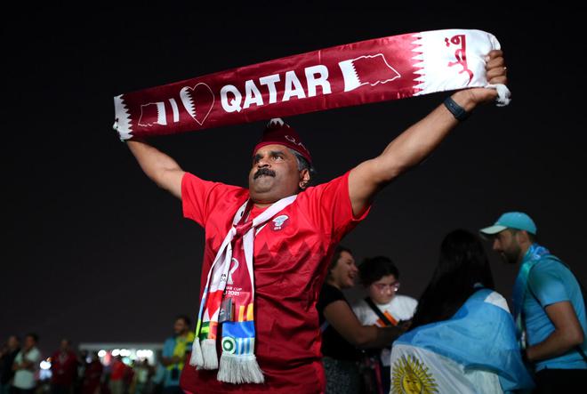 Qatar fan enjoys the atmosphere prior to the Fan Festival Official Opening ahead of the FIFA World Cup.