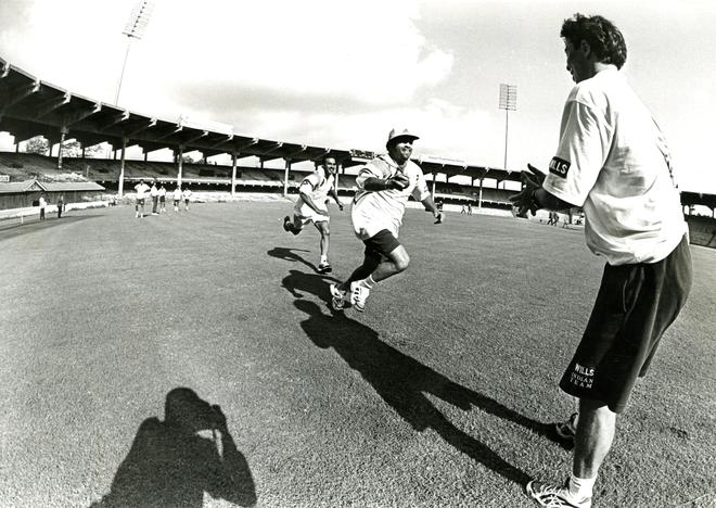 Sachin and Robin Singh go through their sprints under the watchful eyes of Australian physio, Andrew Kokinos, during a training session at the M. A. Chidambaram stadium, Chennai, in 1998. 