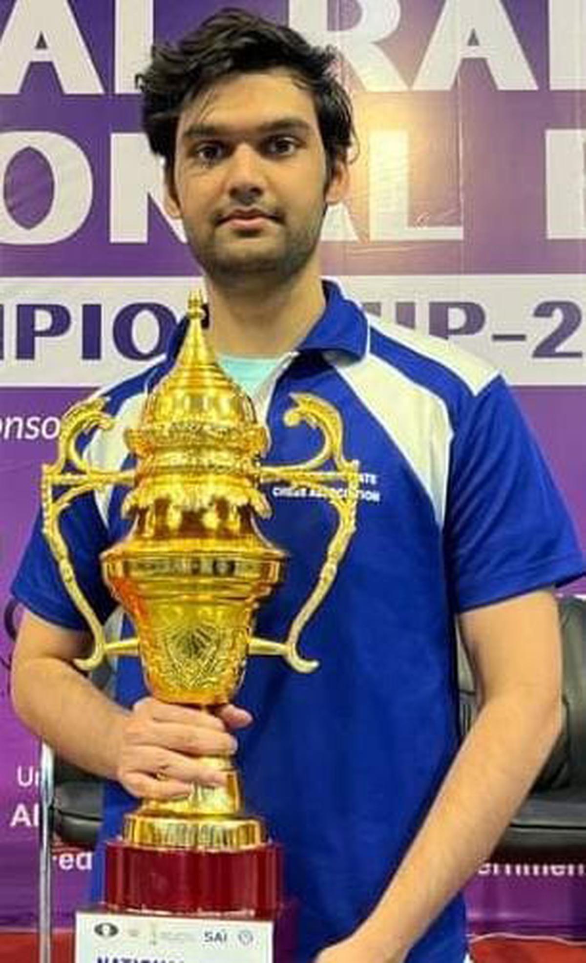 GM Raja Rithvik with the runner-up trophy inthe National Blitz chess championship in Nashik.