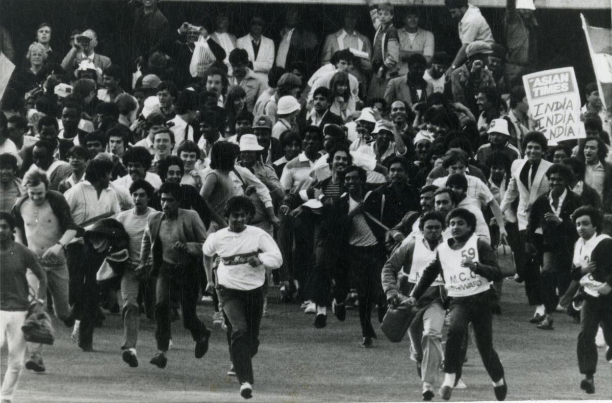 Supporters of the Indian cricket team invade the pitch at Lord‘s on June 25, 1983 after the team had won the Prudential World Cup.  